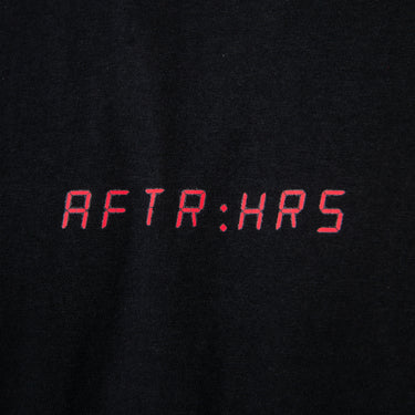 Black shirt with red text 'AFTR:HRS' on a black background