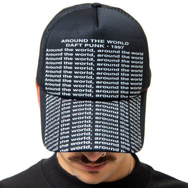 Person wearing a black cap with text 'Around the world, Daft Punk 1997' on a white background