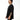 Man wearing a black t-shirt with a logo on a white background