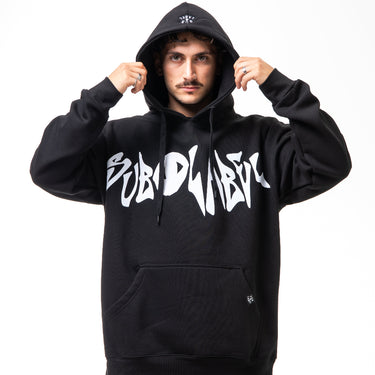 Person wearing a black hoodie with white text on a white background