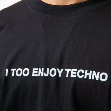 Black t-shirt with 'I TOO ENJOY TECHNO' text on a plain background