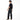 Person wearing black t-shirt and jeans standing against a white background