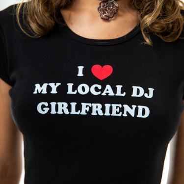Black t-shirt with 'I ❤️ MY LOCAL DJ GIRLFRIEND' text worn by a person.