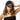 Woman wearing a black cap and black top with 'AFTR-HRS' text on a white background