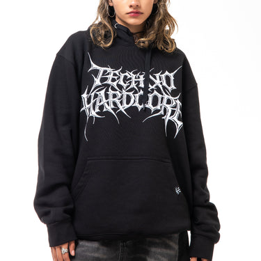 Person wearing a black hoodie with white text on a white background