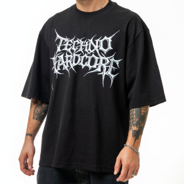 Man wearing a black t-shirt with white text on a white background