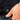 Hand with 'SUB LABEL' hem tag