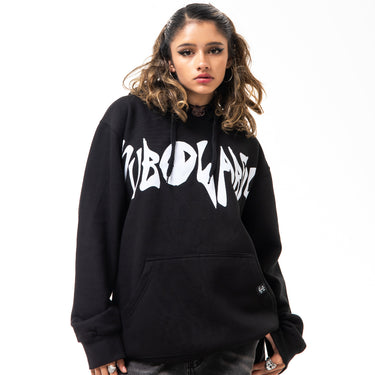 Person wearing a black hoodie with white text on a white background