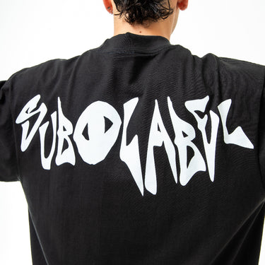 Black tshirt with white 'Sublabel' branding on a plain background