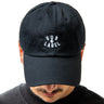 Black cap with 'SUB LABEL' logo worn by a person on a white background