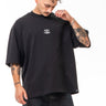Person wearing a black t-shirt and jeans on a white background