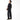 Person wearing a black outfit on a white background