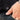 Hand with 'SUB LABEL' hem tag
