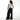 Person wearing a white t-shirt and black wide-leg pants on a white background