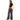 Woman wearing black sleeveless top and wide-leg jeans on a white background