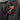 Person wearing dark jeans with a keychain featuring a small troll figure and text.