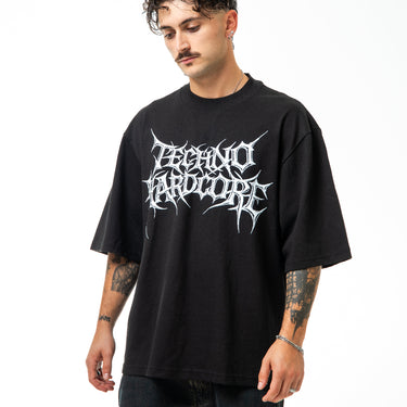 Person wearing a black t-shirt with white text on a white background