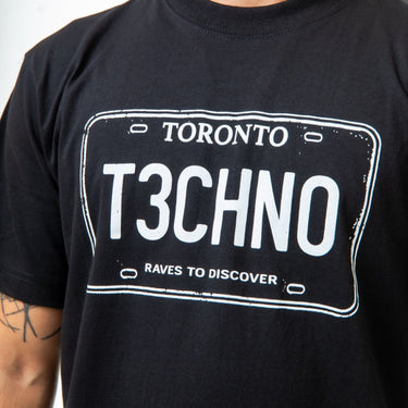 Black t-shirt with 'Toronto T3CHNO' design on a plain background