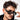 Person wearing black sunglasses with a neutral background
